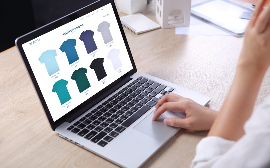Business woman choosing tshirt on ecommerce webshop